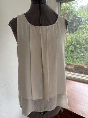 HD in Paris lightweight cream pleated top with short sleeves from Anthropology.